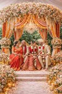 Wedding celebration under floral mandap
